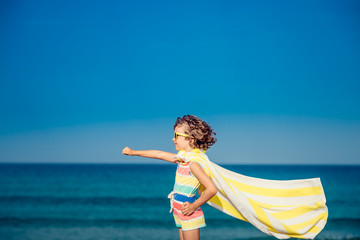 Child having fun on the beach