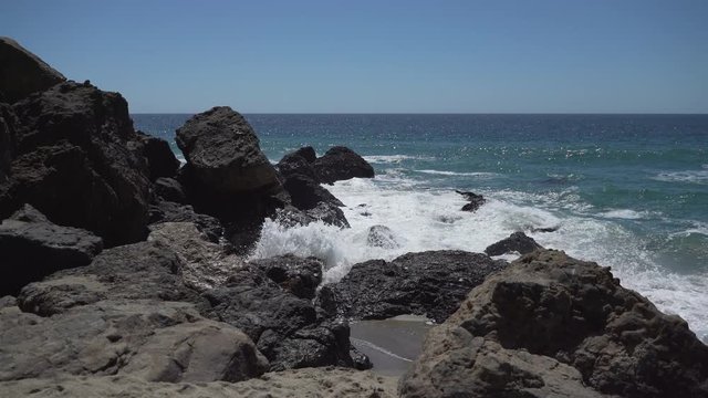 Waves crash against rocks at Point Dume
