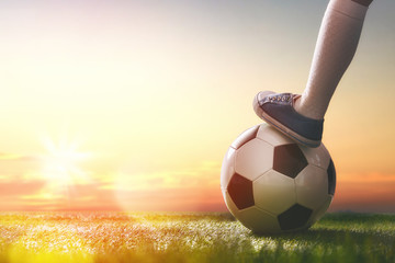 Child plays football.