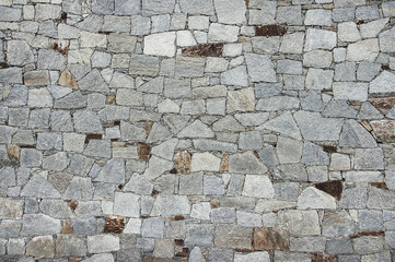 Old grey stone wall background texture