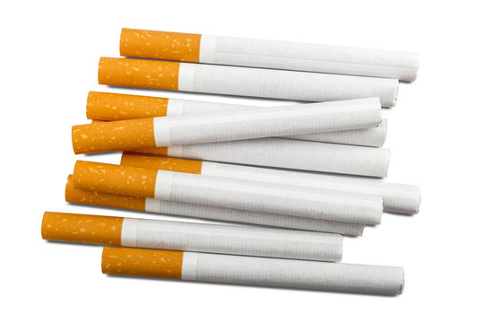 Top view of a pile of cigarettes over white background