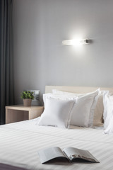 one double bed in the hotel next to the nightstand with the flower