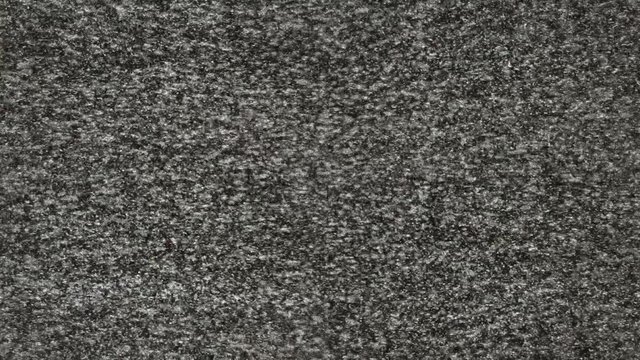 Static noise from a TV that turns off after a while. This mixes real footage and digital video, there's some moirè to make it more realistic. NOTE: the low-res comp could lie, due to compression.