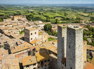 Fototapeta na wymiar aerial view to two towers and old city in summer day in Tuscany in Italy