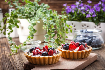 Fresh homemade fruit tart with strawberries and blueberries.