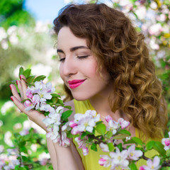 Fototapeta premium portrait of happy beautiful girl in summer garden