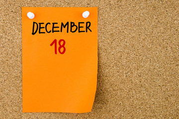 18 DECEMBER written on orange paper note