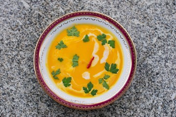 Sweet potato creamy soup asian or thai style vegan soup prepared from sweet potatoes or yam with...