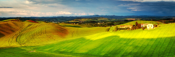 Tuscany scenery: green fields and  hills, panorama landscape.