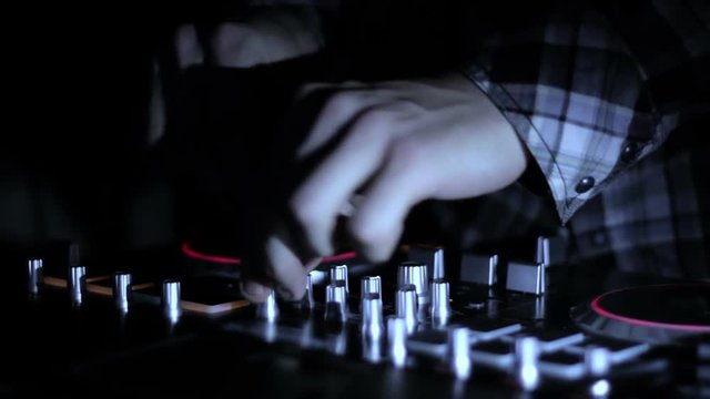 Hands of DJ which mixes music tracks CD mixer in nightclub 11