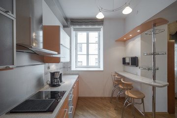 Kitchen in the interior of the studio apartments.