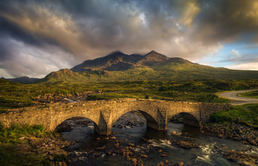 Sligachan Bridge and cloudy Black Cuillins in sunset light, Isle of Skye, Scotland