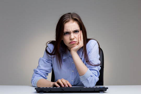 Grumpy Woman Using Keyboard