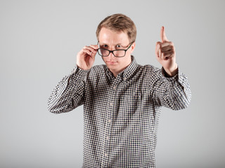 Man points forefinger up