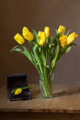 Still life with a bunch of yellow tulips