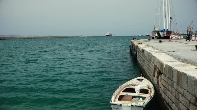 Boat in the harbor, view of Heraklion pier.