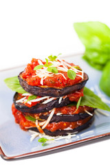 Layered Italian Eggplant Appetizer on White Background. Selective focus.