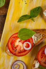 Bruschetta Sandwich with Tomato, Cream Cheese and Basil. Selective focus.
