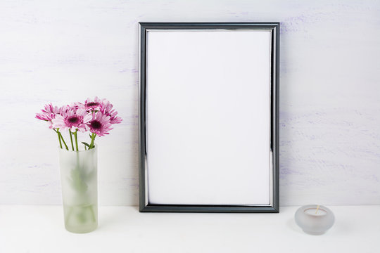 Frame mockup with lilac daisies