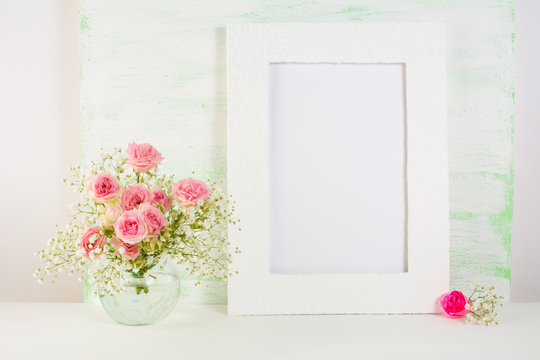 Frame mockup with roses in vase
