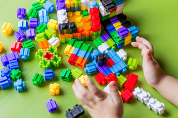 Little child playing  plastic blocks