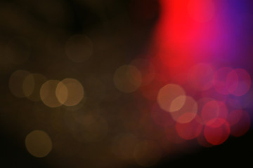 Dark colorful bokeh with red light for nightlife concept