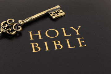 Holy bible and vintage key on cover concept theology study