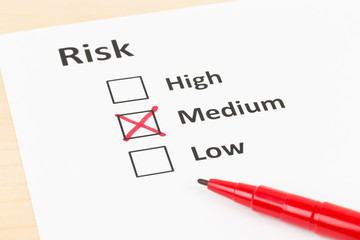 Risk assessment check box and pen