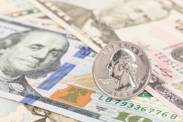 Dollar coin stand on us banknote money