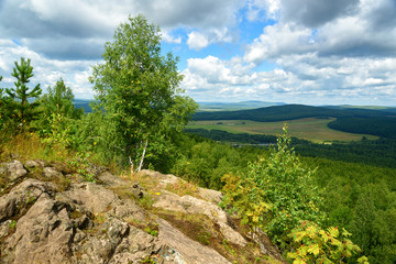Fototapeta na wymiar View of forest, mountains, fields from Lipovaya Mount