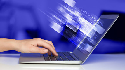 Fototapeta na wymiar Close up of man typing on laptop computer