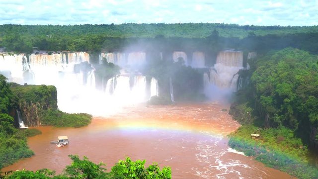 View of Iguazu waterfalls with a rainbow at Brazilian side 4K Ultrahd