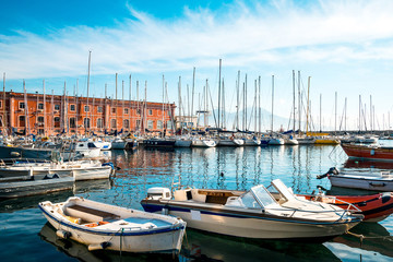 Fototapeta premium Street view of Naples harbor with boats, italy Europe