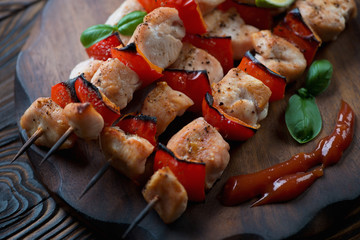 Close-up of kabobs with chicken fillet and bell pepper slices