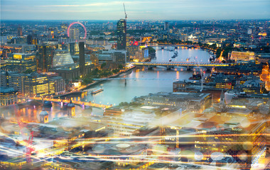 London at sunset, river Thames and traffic lights effect. Modern life concept