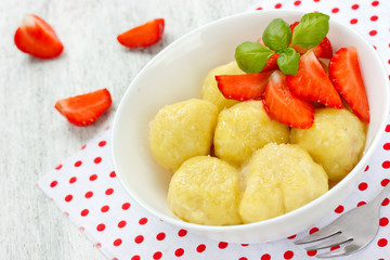 Lazy dumplings with cottage cheese and strawberries summer dessert