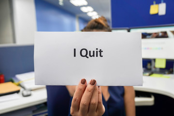 woman hold a piece of paper of I quit the job