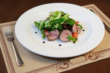 Fresh salad with chicken, tomatoes and mixed greens