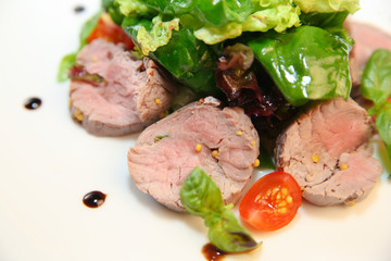 Fresh salad with chicken, tomatoes and mixed greens