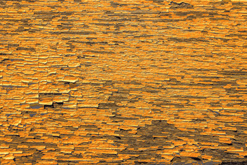 fond peinture ocre écaillée sur vieux bois 