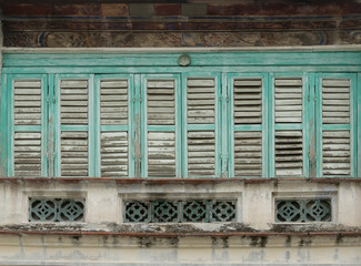 Antique wooden windows on an old building. Architectural elements.