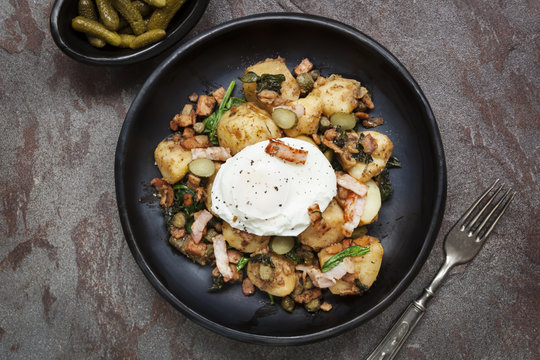 Potato and  Spinach Hash with Cornichons Bacon and Poached Egg