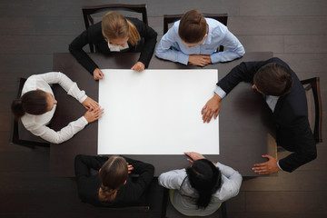 Business people and blank paper