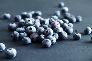 Blueberries background. Ripe and juicy fresh picked bilberries close up