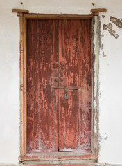 Rustic antique wooden door. Architectural element. Material construction.