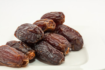 Date fruits in white plate - Ramadan, Eid background