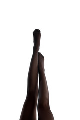 woman legs in black tights pointing up isolated on a white