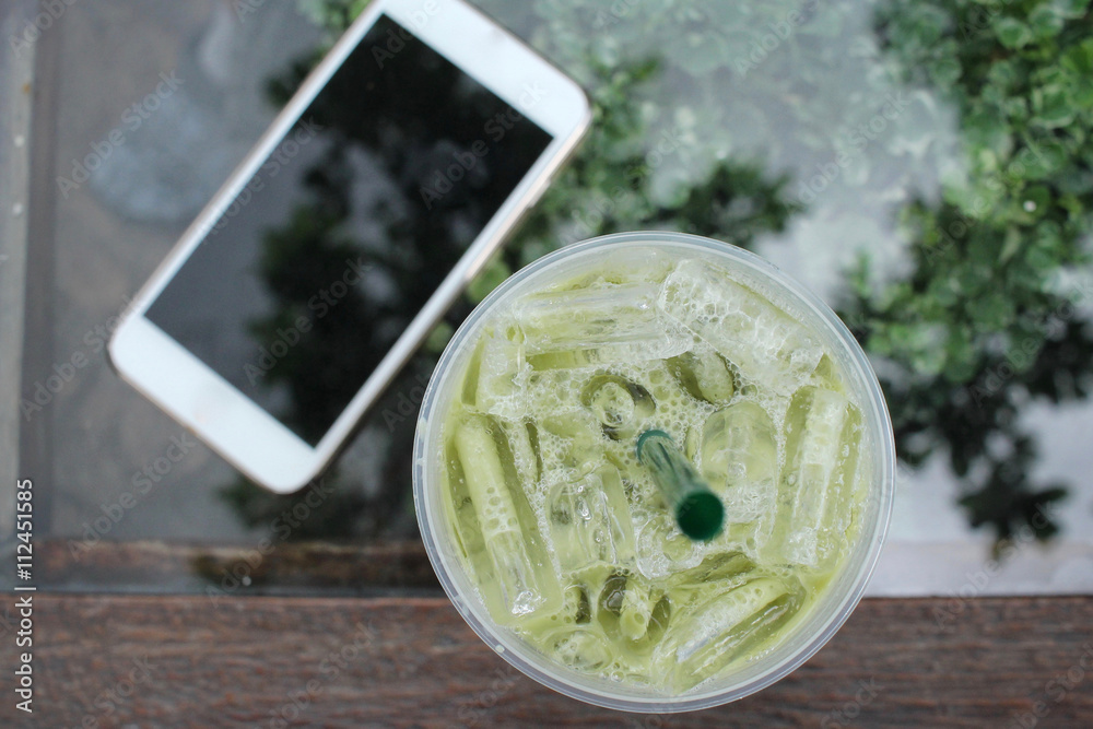 Canvas Prints iced green tea and milk with smart phone