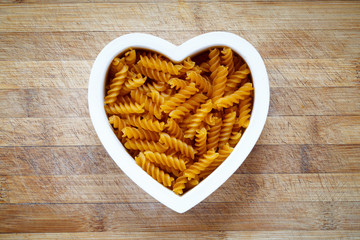 Gluten free pasta in heart shape bowl