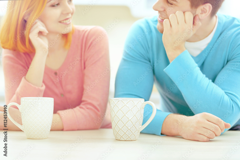 Canvas Prints Young beautiful couple with cups of tea, close up